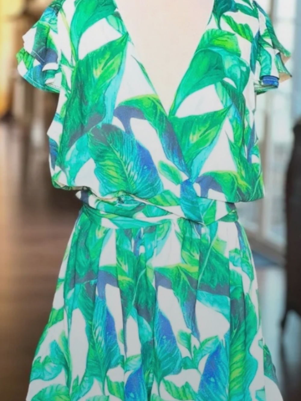 VICI ruffle romper, wrap style that crosses chest and ties in back.